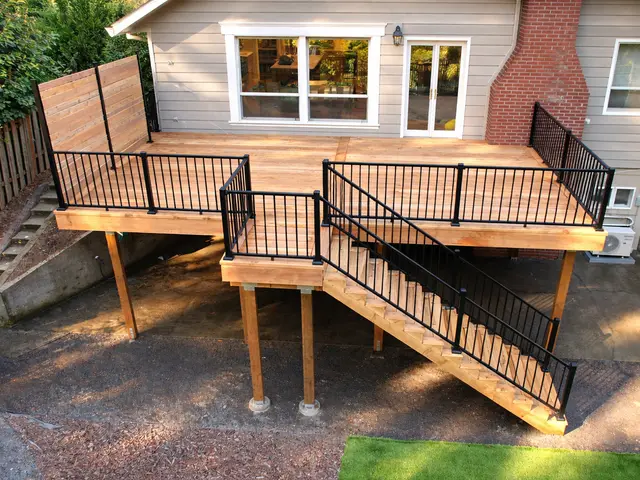 Elevated cedar deck with black metal railing near Ashland OR – RP Construction Management