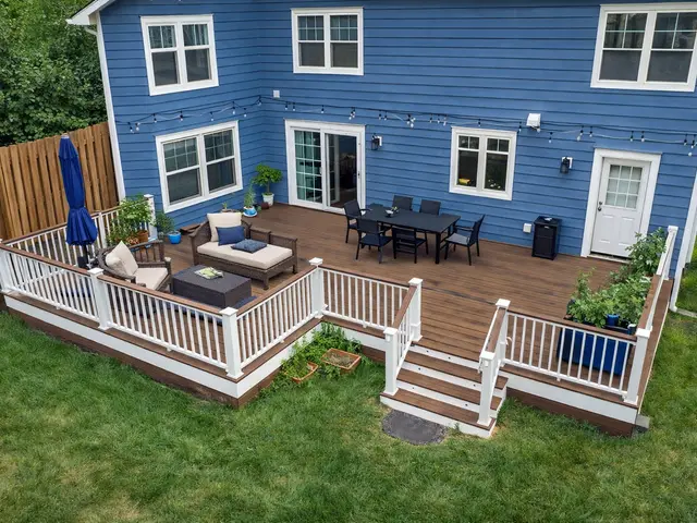 Composite deck with white railing and outdoor furniture in Central Point OR – RP Construction Management