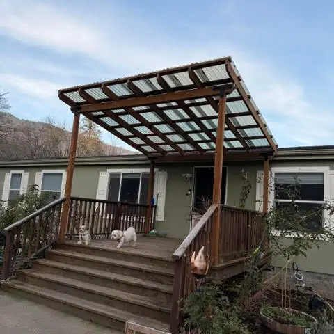 Covered pergola with corrugated roof over deck near Ashland OR – RP Construction Management